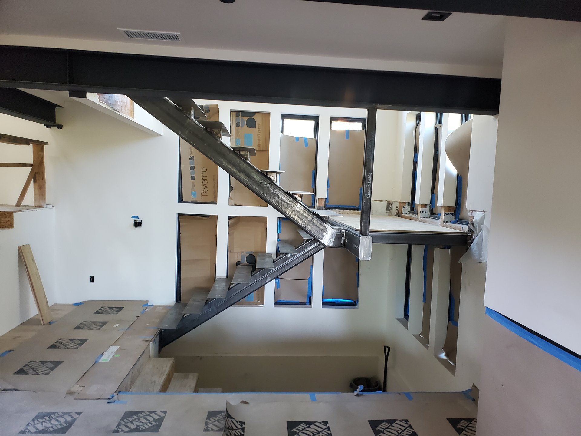 Custom floating steel staircase with mono-stringer in a modern Carson Valley home