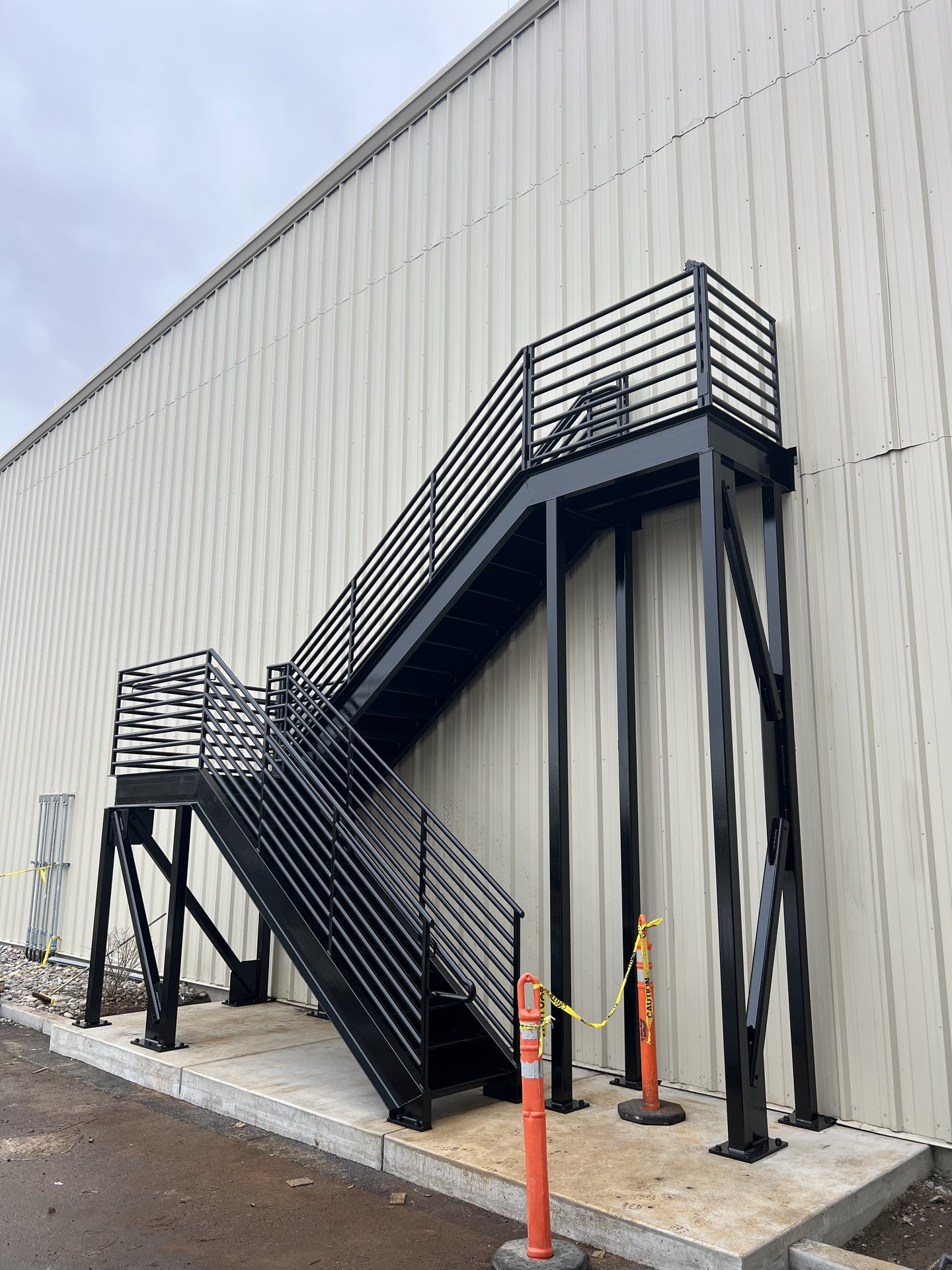 Exterior steel egress staircase installed on a commercial building