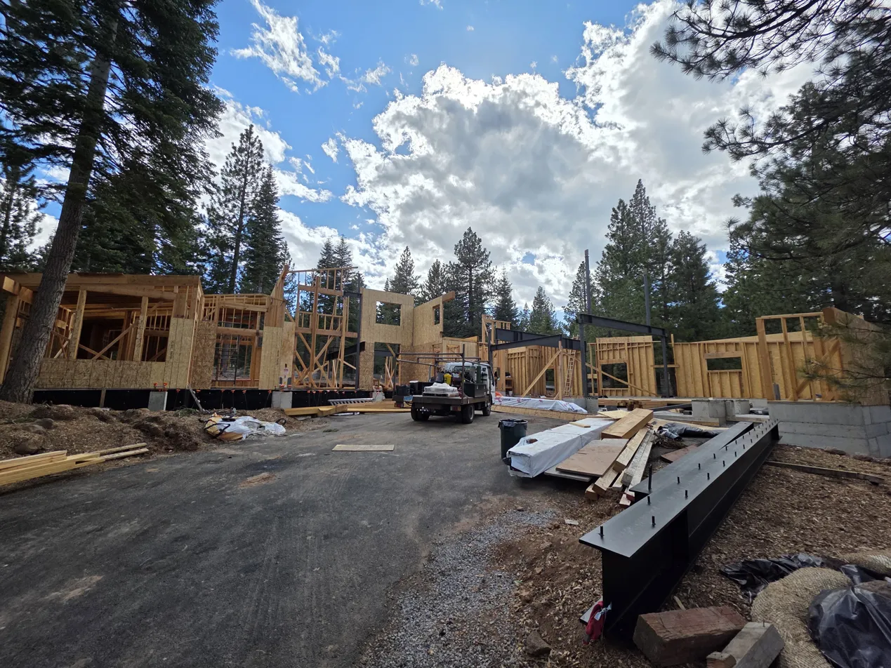 Dalal Residence custom home framing in Truckee, NV with steel beams staged on site